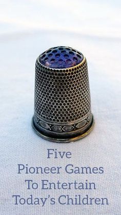 a close up of a thimble on top of a piece of paper with the words five phoner games to entertain today's children