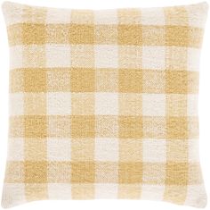 a yellow and white checkered pillow on a white background