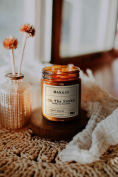 a jar of candles sitting on top of a table