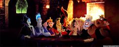 cartoon characters sitting around a table in a dark room