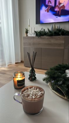 hot chocolate and marshmallows in a mug on a table