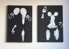 two black and white paintings with hand prints on them