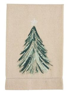 a white towel with a green christmas tree on it