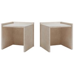 two tables made out of plywood and concrete, one is shaped like a corner