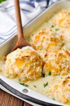 a casserole dish filled with cheese and meatballs