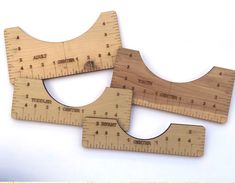 two wooden rulers sitting on top of each other