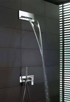 a shower head with water flowing from it