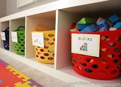 the shelves are filled with toys and books for children to play with in their homes