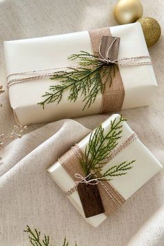 two wrapped presents are sitting on a table