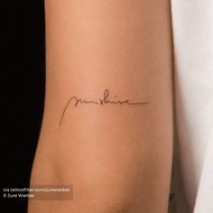 a woman's arm with a small tattoo on it that reads, love is sunshine