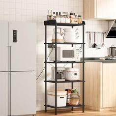 a kitchen filled with lots of appliances next to a refrigerator