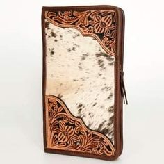 This gorgeous case has genuine hide and gorgeous leather tooling. SIZE: H8.5XW13 Hair On Hide Purse, Leather Tooled Jewelry Case, Cowhide Travel Jewelry Case, Cowhide Wallet, Leather Phone Case Western, Saddle Blanket, Gorgeous Leather, Western Boho, Cow Hide