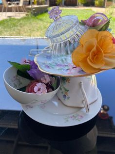 tea cups and saucers with flowers on them