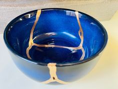 a blue bowl sitting on top of a counter