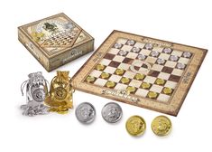 a chess board and game pieces are shown in front of a box with coins on it