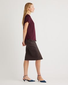 We love to luxe up an everyday look. This classic tee is made from washable silk, with a bit of stretch for the perfect fit. The crew neck and tulip hem gives it a little curvature for a more premium look. The washable silk makes this top super easy to care for. Plus, silk fiber contains 18 kinds of amino acids that make it amazing for skin nourishment, hypo-allergenic, and naturally thermoregulating to help maintain body temperature.  | Quince | Women's Washable Stretch Silk T-Shirt in Wine Tas Relaxed Fit Everyday T-shirt, Elegant Workwear T-shirt For Fall, Elegant Relaxed Fit T-shirt For Everyday, Silk Fiber, Silk Tee, Silk T Shirt, Natural Textiles, Black Camel, Silk Camisole