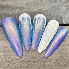 Dawn Witch Designs Unique, re-usable, hand painted, and made in Canada. These luxury press on nails are handmade using high quality gel polish and salon-grade materials.  ✨ FROSTED SEASON ✨  This set has a beautiful blue shimmer with 3D icicles and a 3D sweater nail as an accent. It's the perfect set for the winter season! *The shape shown in the pictures is the MEDIUM ALMOND *Colours may appear a little different due to your personal monitor settings* *The shape shown in the pictures is the LON Almond Nail Art Christmas, Extra Winter Nails, Cold Nail Designs, Iridescent Snowflake Nails, Holiday Glass Nails, December Nails Stilleto, Blue Christmas Nails Designs, Blue Winter Nail Designs Short, Blue Sweater Nail Designs