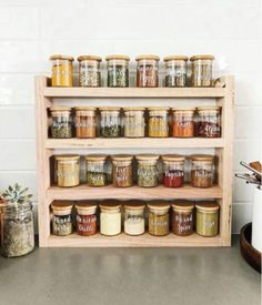 a shelf filled with lots of different types of spices