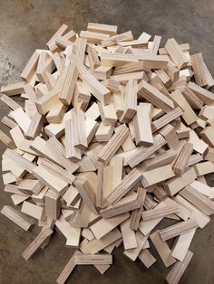 large pile of wood blocks on the ground