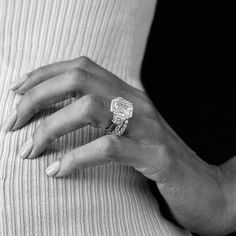 a woman's hand with a ring on her finger