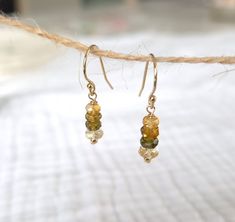 Pretty earrings in 14-carat Gold Filled Gold, made with natural Tundra Sapphires and Citrine rounds. For your comfort and more security, the hooks will be equipped with small silicone strollers 🤍 ✨️ 14k Gold Filled ✨️ Gold Filled is a 14k gold finish applied to a brass base. The weight of gold corresponds to 1/20 of the total weight of the product, or approximately 50 to 100 times more than in a classic gold-plated product. It will not tarnish, peel or change color. People allergic to certain m Adjustable Gemstone Briolette Earrings, Yellow Gold Dangle Earrings With Birthstone, Citrine Briolette Earrings As Gift, Adjustable Dangle Birthstone Earrings, Citrine Beads, Allergic Reaction, Birthday Woman, Classic Gold, Pretty Earrings