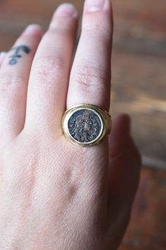 "A truly special piece, this heavy 14K statement ring's bold mounting frames the 1660s coin featuring the king Johann Casimir of Lithuania. It is a very comfortable piece to wear, is perfectly suited for a man or woman, and is in excellent overall condition. It is the perfect right hand, statement piece. Materials: 14K (carefully tested for metal purity); Copper Coin Hallmark: \"14K\" Dimensions: Top-- 15mm round; Shank-- 5mm Weight: 17.40 grams Size: 8 & 1/4 (Can be sized) Age: Mounting--Ci Copper Coin, Copper Coins, Style Statement, Lithuania, Right Hand, The King, Statement Ring, Statement Pieces, Statement Rings