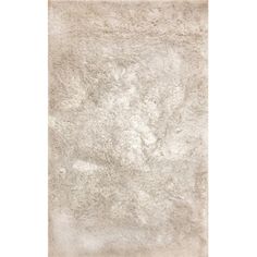 an area rug with white fur on the top and bottom, it is very soft