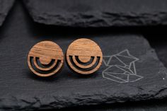 The circle stud earrings are characterized by delicate, slender shapes - they accentuate the wearer, but also allow them to express their character. Inspired by nature, the jewelry not only impresses with its natural design, but also with its uniqueness - it is simply impossible to make two identical pairs of earrings. A thick wood veneer in the color of alder or walnut was used to make the circular earrings. The material is additionally protected with wood butter - however, it is worth removing Minimalist Round Plug Earrings As Gift, Hypoallergenic Nature-inspired Round Earrings, Wood And Brass Earrings, Wooden Stud Earrings, Wood Veneer Earrings, Wood Earring Stud, Handmade Wooden Jewelry, Brown Wooden Earrings For Pierced Ears, Wood Butter