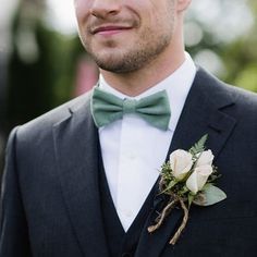 a man in a tuxedo with a boutonniere on his lapel