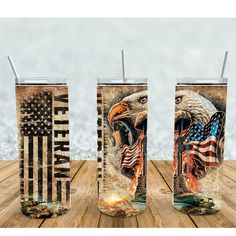 two tumblers with american flags and an eagle on them, sitting on a wooden table