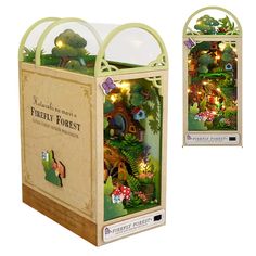 an open cardboard box with fairy forest scene inside