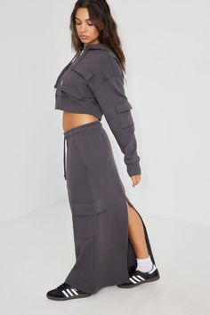 Okay but the sweat skirt though? I'm- Features - Drawstring at elasticized waistband - Side cargo pockets - Central slit at back hem - Fleece lining Size & Fit - Rise: Mid-rise - Length: Maxi - Model is wearing size S Materials & Care - Content: 65% cotton, 35% polyester - Care: Machine wash, cold - Imported Garage Clothing, Next Clothes, Cargo Skirt, Gray Skirt, Bottom Clothes, Grey Hoodie, Bottoms Pants, Maxi Skirt, Mid Rise