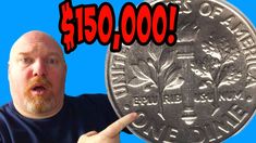 a man holding up a coin with the words $ 150, 000 on it in front of him