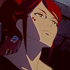 a woman with red hair and yellow eyes stares into the distance while standing in front of a building