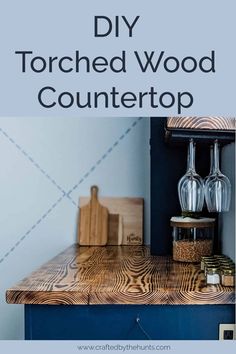 a wooden counter top with text overlay that reads diy torched wood countertop