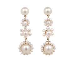 With their stylish interpretation of the traditional pearl drop, these Sophie Bille Brahe earrings are a stunning alternative. Three different freshwater pearl flower designs are backed by 14K yellow gold and hang from the round freshwater pearl which attaches to the 14K yellow gold post back. An earring with the perfect amount of statement-making movement. total length : just over 1 1/2"width : 1/2"freshwater pearls : vary : 2mm diameter to 7mm diameter each14K yellow gold post backs Earrings With Pearls, Sophie Bille Brahe, Luminous Colours, Pearl Flower, Pearl Drop, Flower Earrings, Pretty Things, Flower Designs, Freshwater Pearls