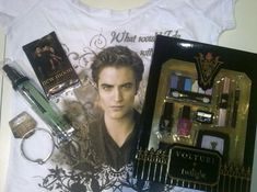 an assortment of items are displayed on a white t - shirt with the twilight movie poster