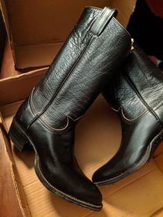 Vintage 1975 Tony Lama Black Buffalo Boots.  These have never been worn.  I found them in my Grandparent's attic and they were meant for my Uncle for Christmas in 1975 but he died in a motorcycle accident before they could give them to him.  Original box, stickers, instructions, etc.   Per a helpful contact: "Size "465" means men's size 6-1/2 D. The way the code works is, the first character is the width: A, B, C, D = 1, 2, 3, 4. The rest of the numbers are the length, ending with 0 or 5 for full size or half size. If it were "4065" it would be the same size." I am adding more pics so there is a better perspective on size of these.  The old boot is mine and it is a women's 7.5  I can not get my foot in these boots all the way. (Well if I could I wouldn't be selling them) Buffalo Boots, Old Boots, Engineer Boots, Black Cowboy, Tony Lama, Mens Cowboy, Mens Boots Fashion, Fall Fits, Dec 8