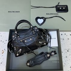 Balenciaga Neo Cagole XS Handbag In Black, For Women, Women’s Bags 15.3in/39cm 700451210B01000 Designer Handheld Satchel For Everyday Use, Designer Handheld Satchel For Travel, Designer Handheld Satchel With Top Carry Handle, Everyday Designer Handheld Satchel, Designer Handheld Satchel With Removable Pouch, Designer Satchel With Detachable Strap For Shopping, Designer Handheld Travel Bag, Designer Box Bag With Handles For On-the-go, Designer Box Bag For On-the-go With Handles