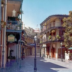 an old fashioned street scene with buildings on both sides