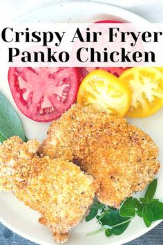 crispy air fryer panko chicken on a white plate with tomatoes and basil