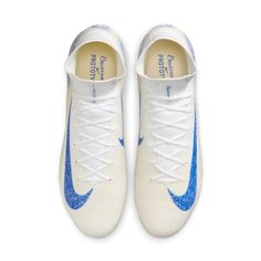 a pair of white and blue nike shoes