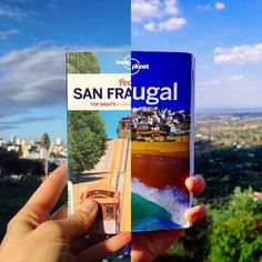 a person holding up a book in front of a cityscape with the words sanfragual on it