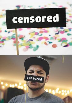 a man holding up a sign with the word censored taped to his face