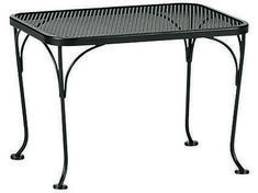 an outdoor table with metal legs