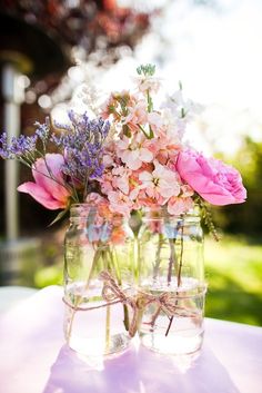 flowers in vases sitting on top of a table with the caption longlevens flowers 22 june 2013 at longlevens