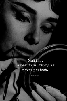 a woman is looking into a mirror with her hand on her face and the caption reads daring, a beautiful thing is never perfect