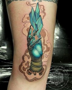 a woman's leg with a tattoo on it