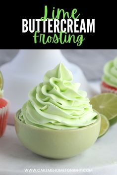 lime buttercream frosting in a white bowl with limes around it and the words lime buttercream frosting