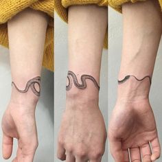 two hands with tattoos on their wrist and one has a snake in the middle of it